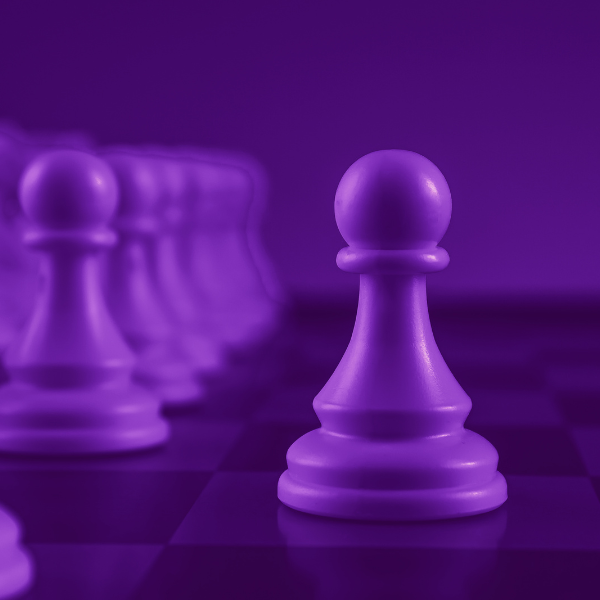 Close-up of a row of white pawns on a chessboard, with one pawn in focus. The image has a purple color overlay. OCIDM,io Branding and Digital marketing Hamilton, Toronto, Oakville, Mississauga